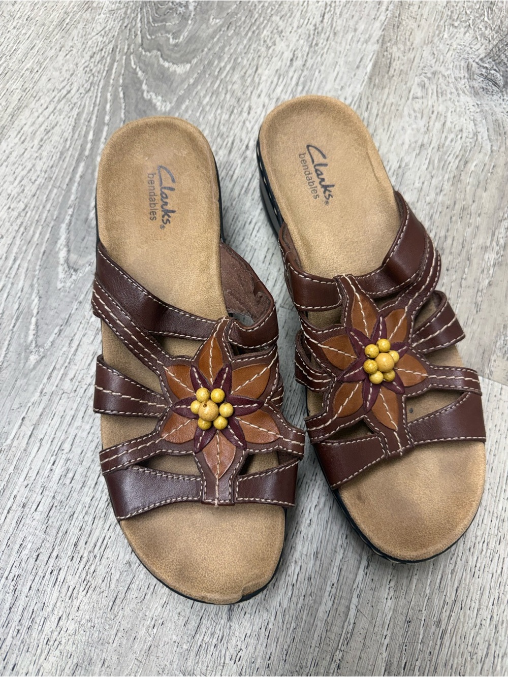Clarks Brown Leather Slip-On Mules with Floral Accent